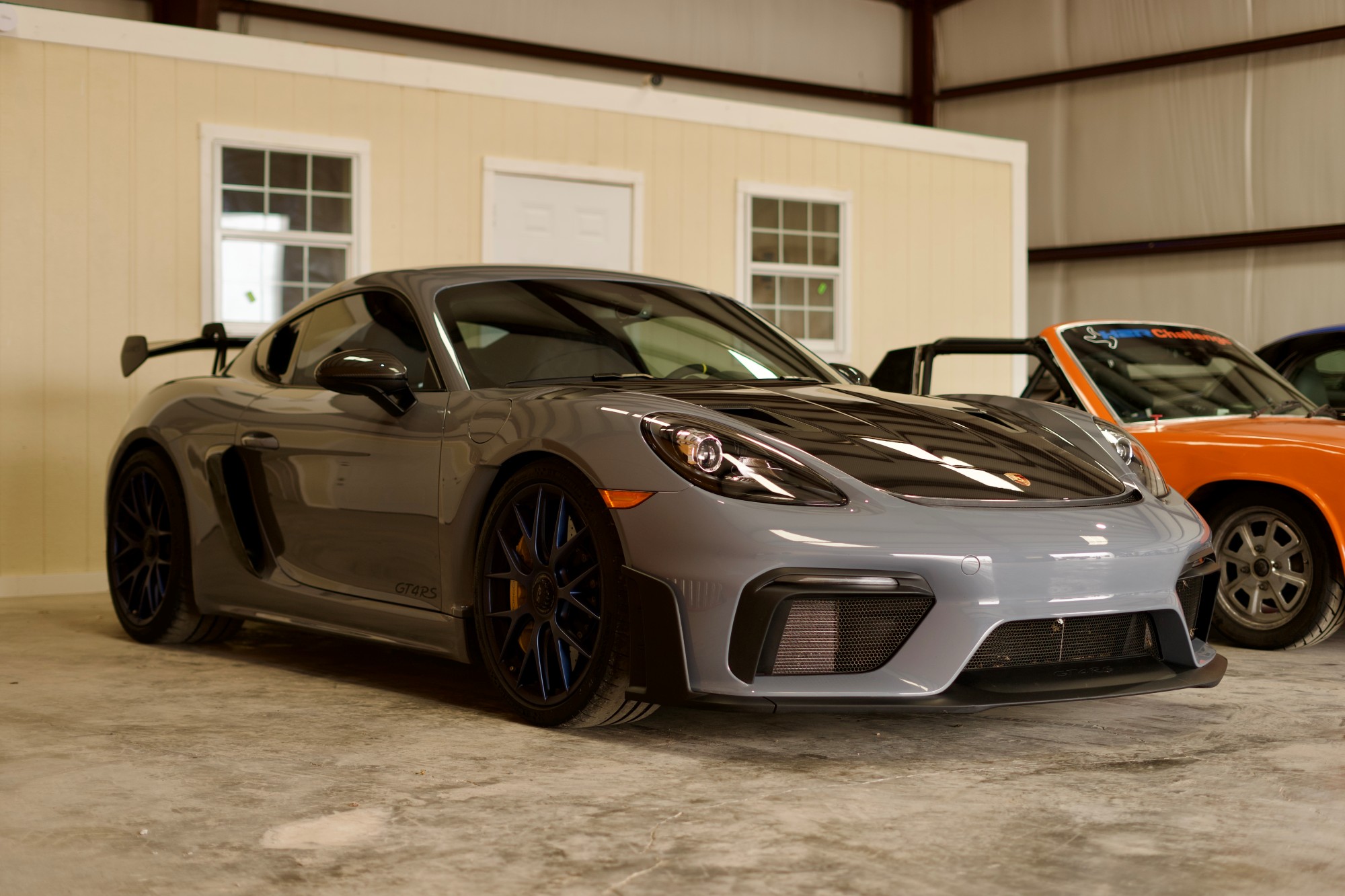Grey Porsche GT4 RS in indoor storage